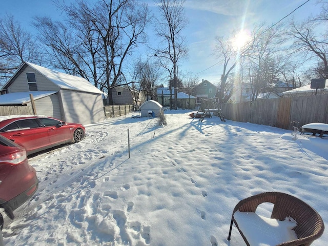 view of yard covered in snow