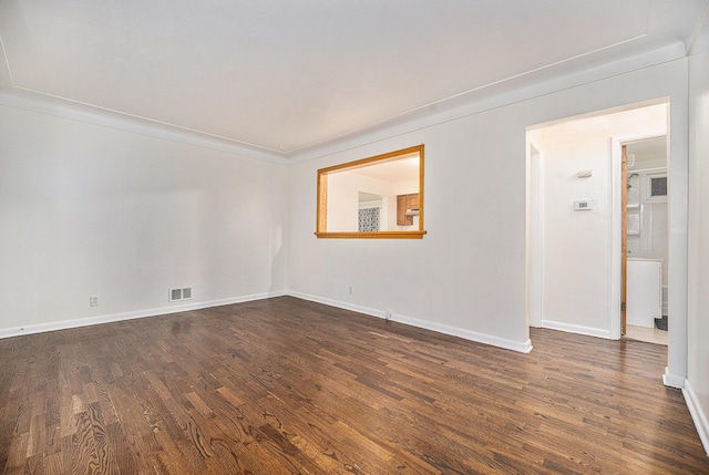 unfurnished room featuring dark hardwood / wood-style flooring