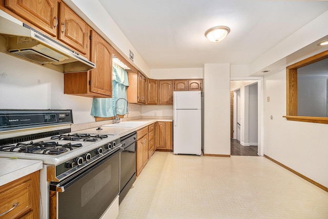 kitchen featuring sink and white appliances