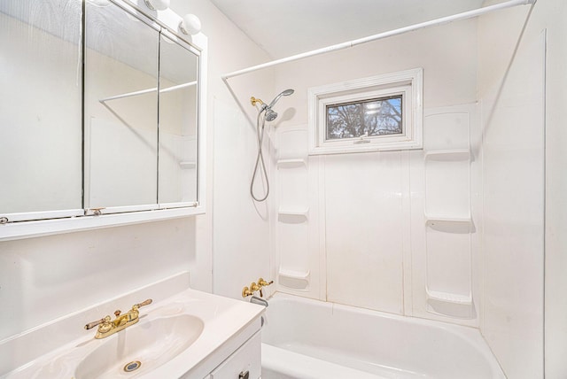 bathroom featuring bathtub / shower combination and vanity