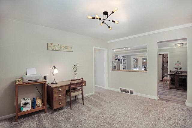 carpeted office featuring a chandelier