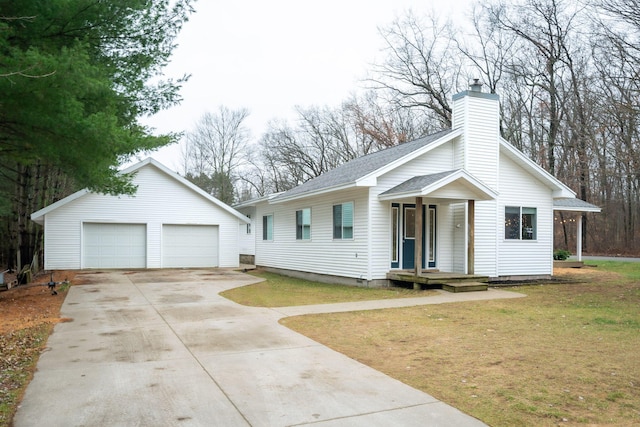 single story home with a garage, an outdoor structure, and a front lawn