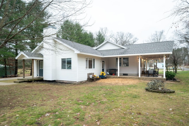 exterior space with a front yard and a porch