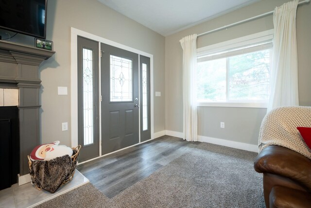 entrance foyer featuring hardwood / wood-style floors and a healthy amount of sunlight