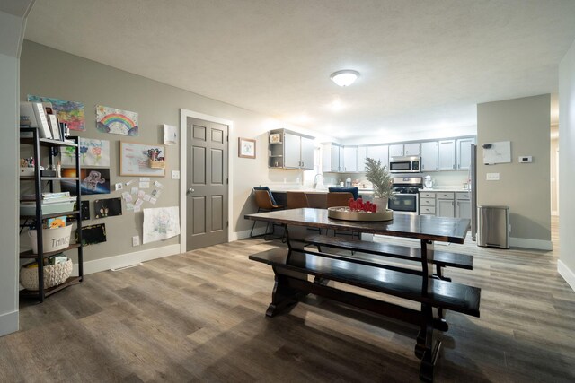 dining area featuring wood-type flooring