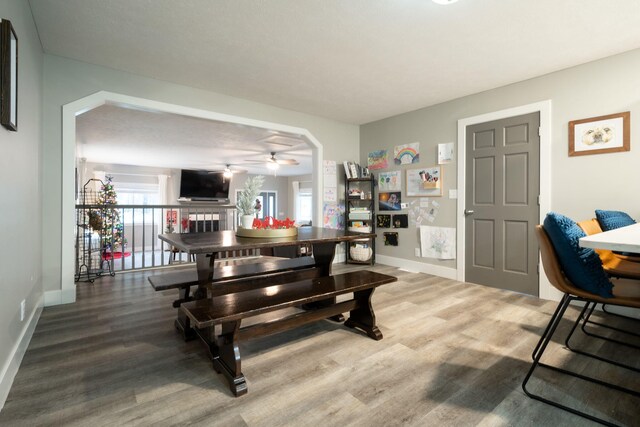 dining area featuring hardwood / wood-style floors and ceiling fan