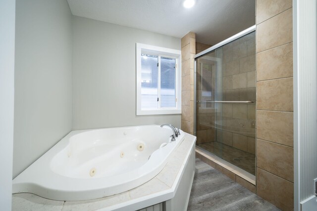 bathroom featuring plus walk in shower