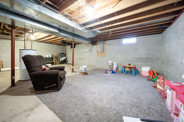 game room with gas water heater, concrete floors, and electric panel