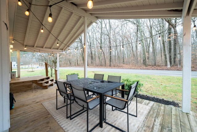 deck featuring a yard and a playground