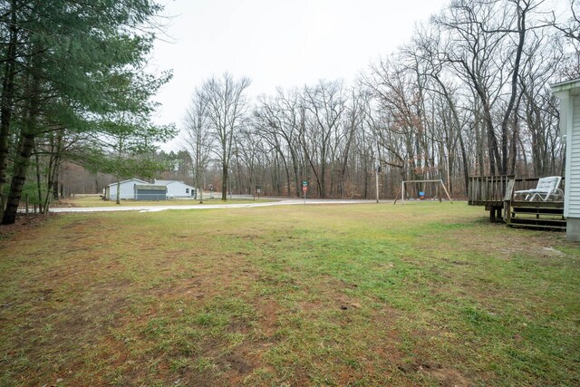 view of yard featuring a wooden deck