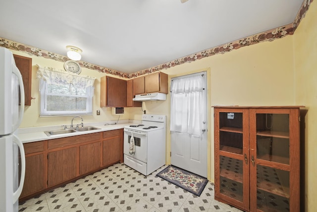 kitchen with white appliances and sink