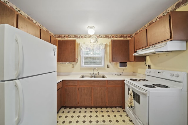 kitchen with sink and white appliances