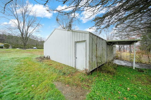 view of outdoor structure featuring a lawn