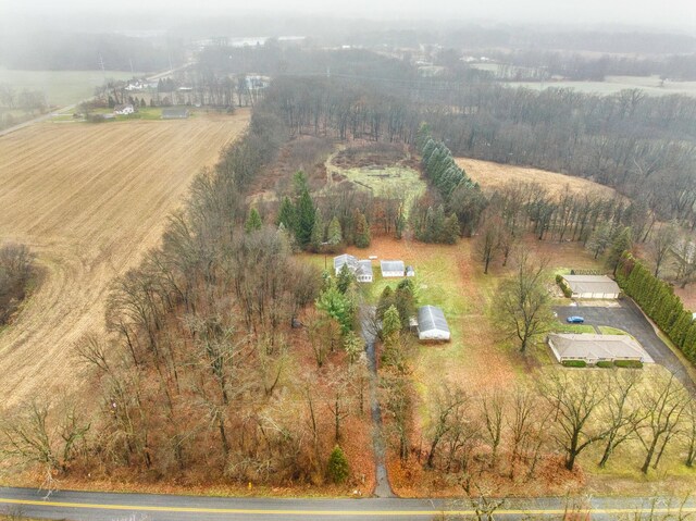 birds eye view of property with a rural view