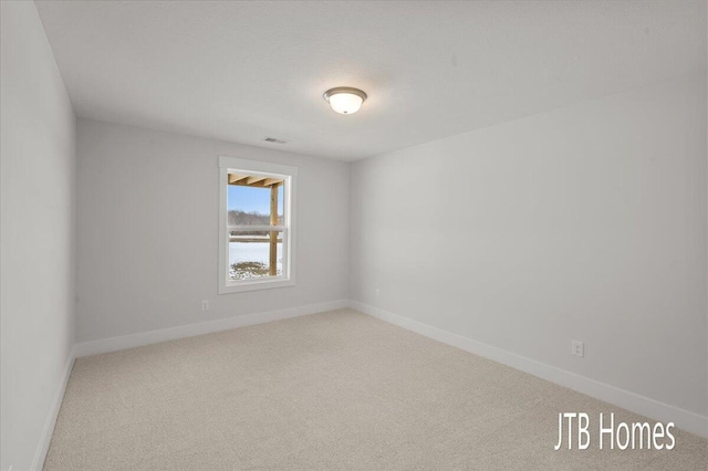 5561 Canal Ave SW Unit 65, Wyoming, MI 49418 - unfurnished room with carpet flooring, visible vents, and baseboards
