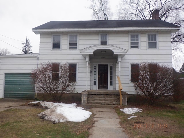 colonial home featuring a garage