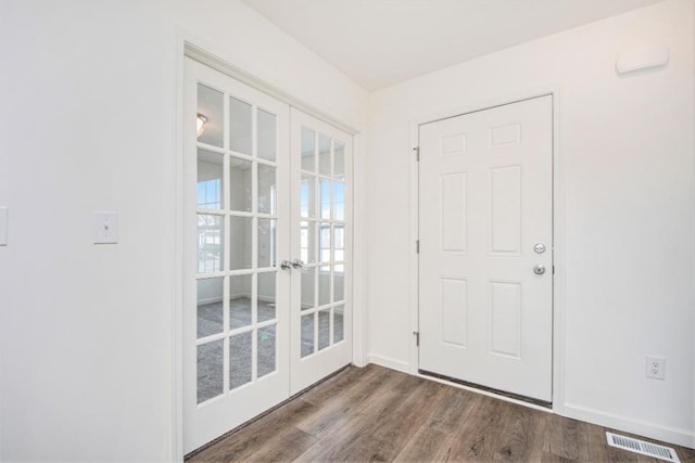 doorway with french doors and wood-type flooring