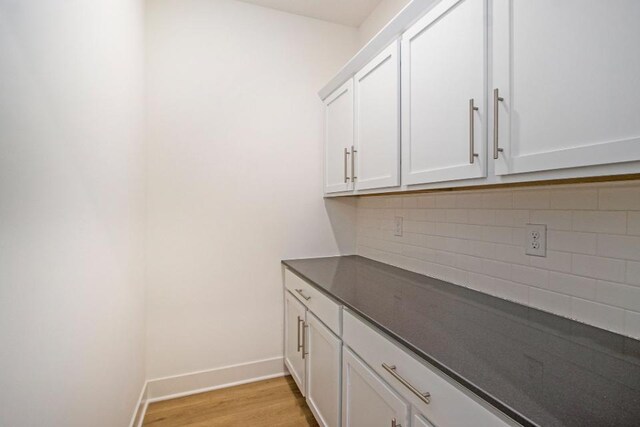 laundry area featuring light hardwood / wood-style flooring