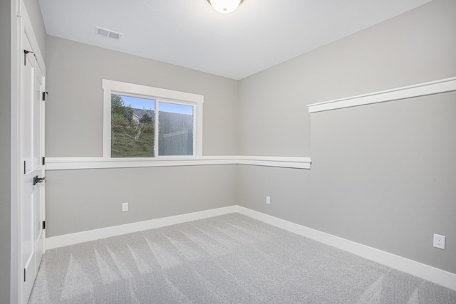 unfurnished room featuring carpet flooring