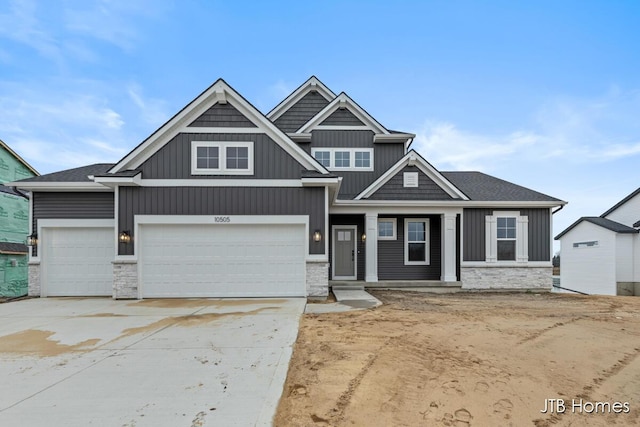 craftsman house with a garage