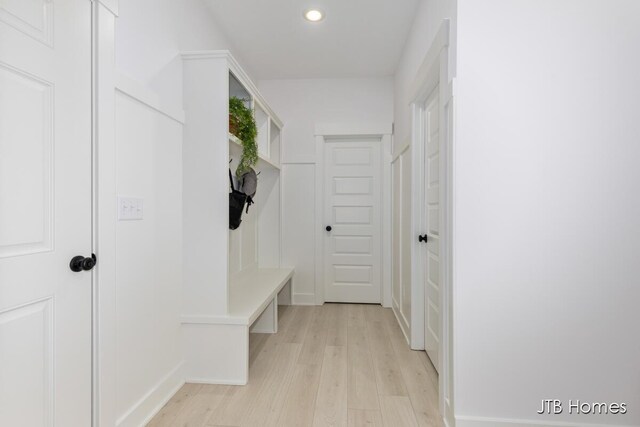 mudroom featuring light wood-style flooring and recessed lighting