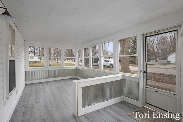 unfurnished sunroom featuring plenty of natural light