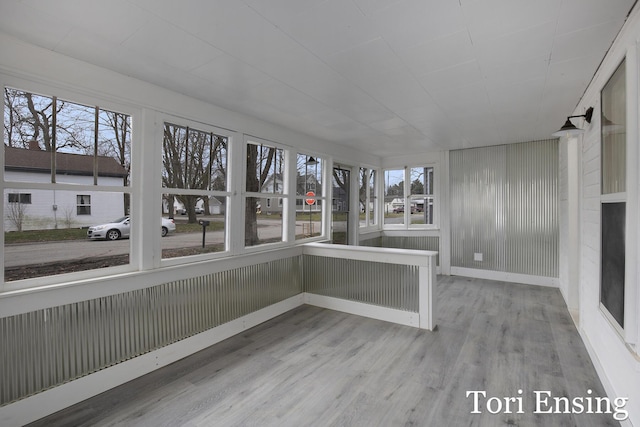 unfurnished sunroom featuring a wealth of natural light