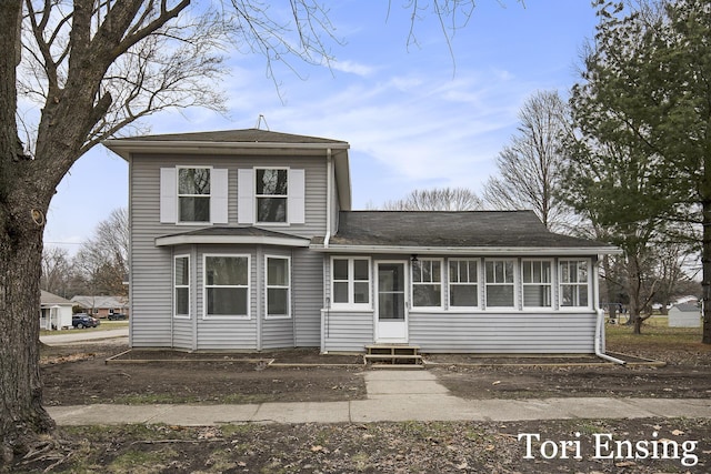 view of front of property with a sunroom