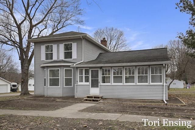 view of front facade with a sunroom