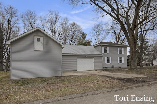 view of side of home with a garage