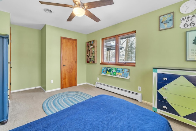 bedroom with carpet, baseboard heating, and ceiling fan