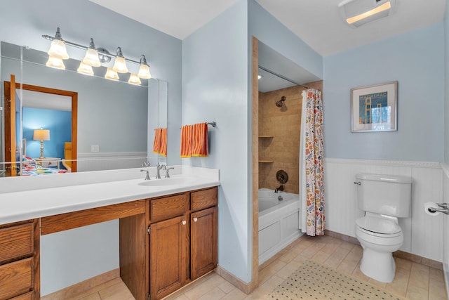 full bathroom featuring toilet, tile patterned floors, shower / bath combination with curtain, and vanity