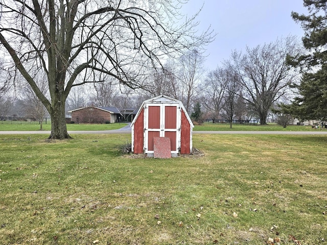 view of outbuilding featuring a lawn