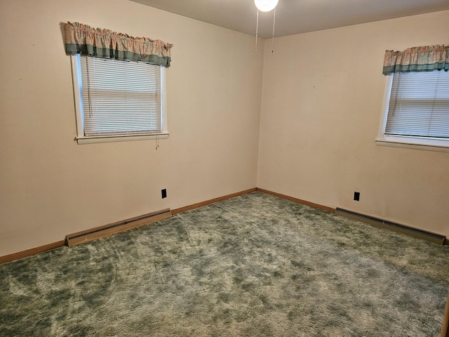 empty room with carpet flooring and a baseboard heating unit