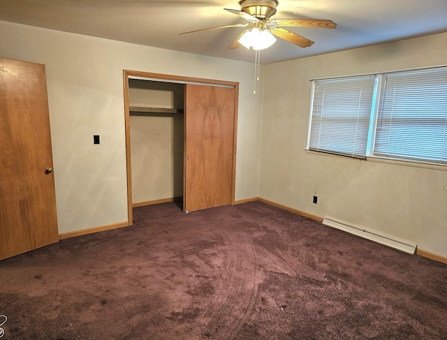 unfurnished bedroom with baseboard heating, ceiling fan, a closet, and dark carpet