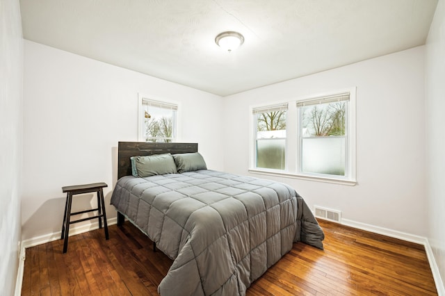 bedroom featuring dark wood-type flooring