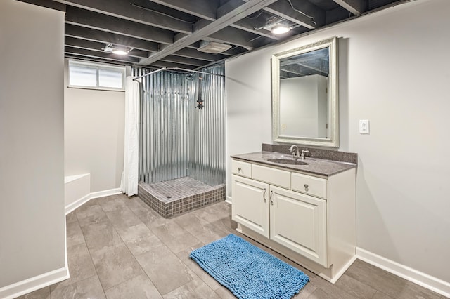 bathroom featuring a shower with curtain and vanity