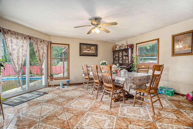 dining space with ceiling fan