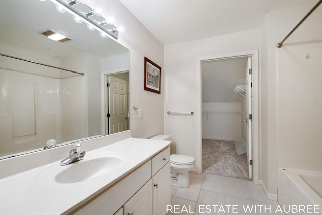 bathroom featuring toilet, tile patterned floors, and vanity