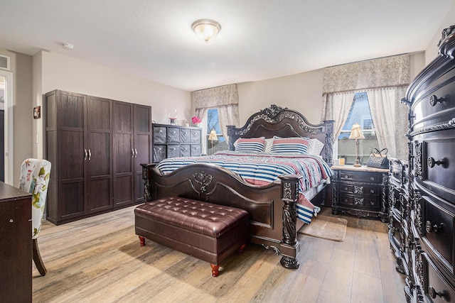 bedroom with light wood-type flooring