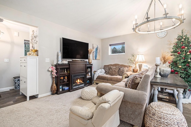 living room featuring dark wood-type flooring and a notable chandelier