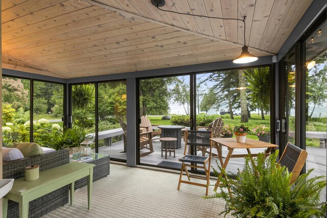 sunroom featuring wood ceiling and vaulted ceiling