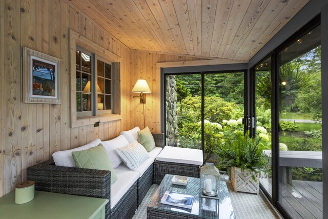 sunroom with vaulted ceiling and wood ceiling