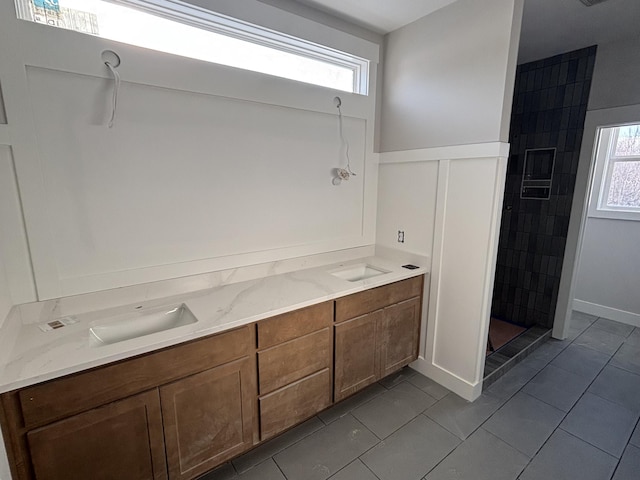 bathroom with vanity, tile patterned floors, and walk in shower