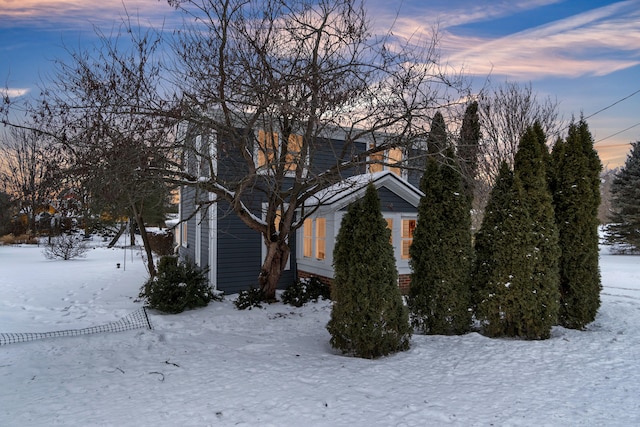 view of property hidden behind natural elements