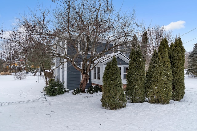 view of snow covered property