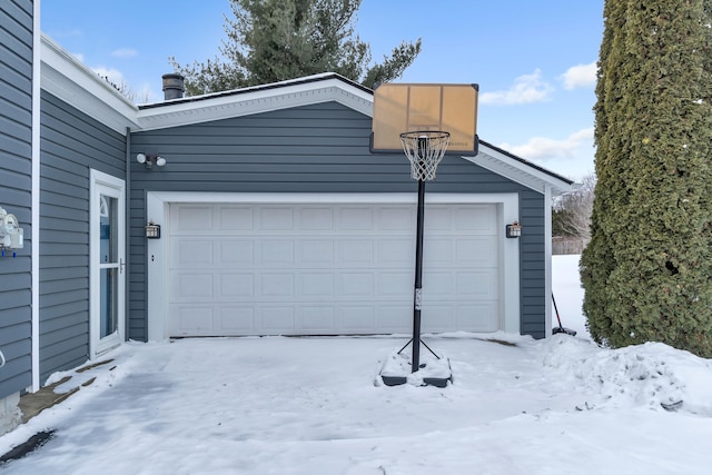 view of snow covered garage