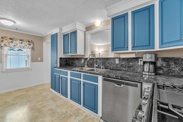 kitchen with stainless steel appliances, a sink, and blue cabinetry