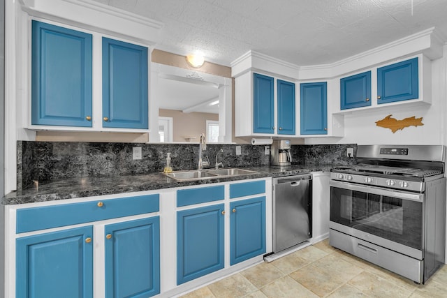 kitchen featuring appliances with stainless steel finishes, backsplash, a sink, and blue cabinets