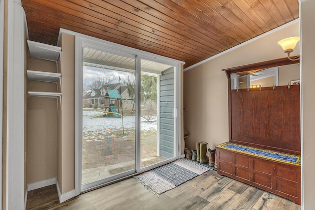 doorway featuring light wood-type flooring, wooden ceiling, and crown molding